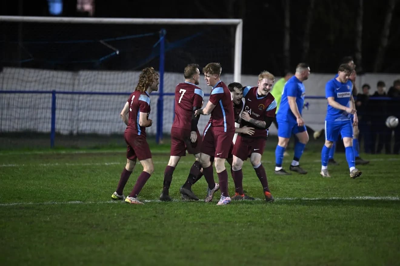 Hathersage F.C. players celebrating together