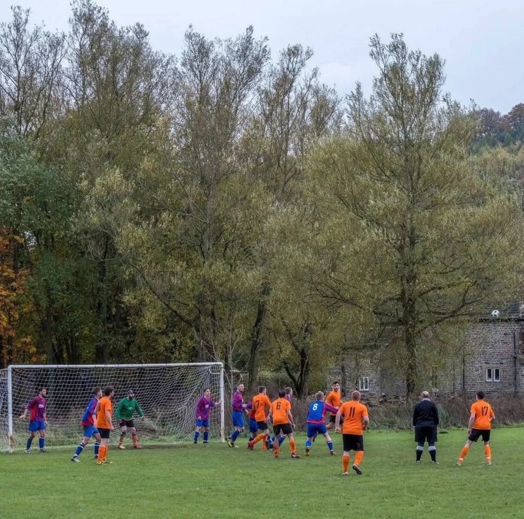 Hathersage F.C. players celebrating together
